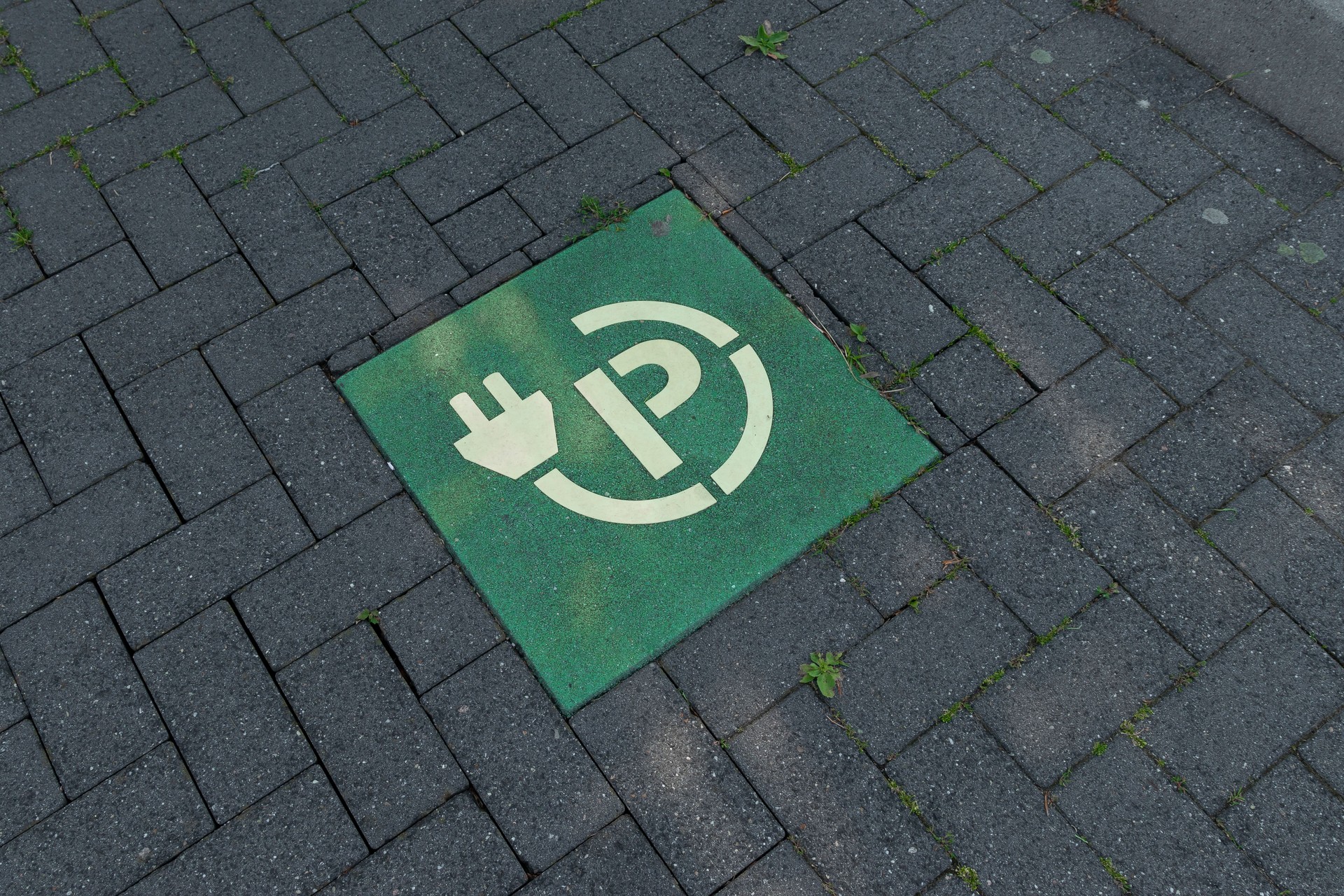 Parking lot for charging an electric car, Green electric vehicle charging station sign